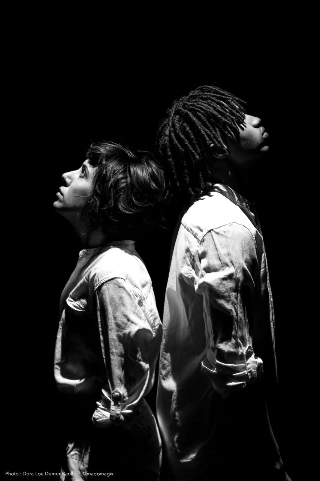 Two dancers back to back, black and white